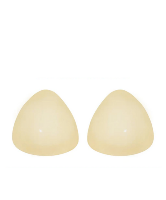A pair of beige-colored nipple covers with a triangular shape.