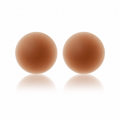 Seamless reusable nipple covers in Coco, shown as a pair