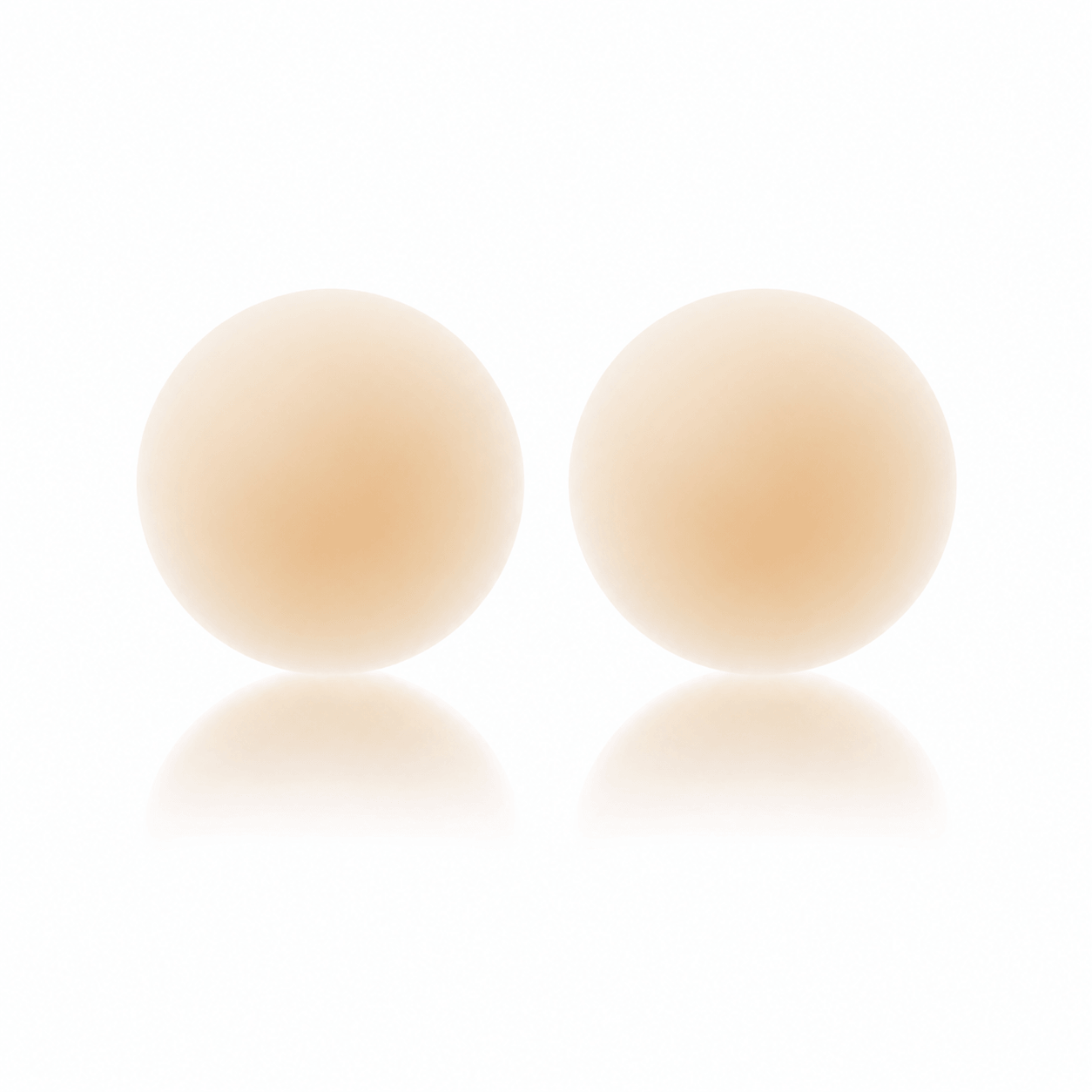 Seamless reusable nipple covers in Creme, shown as a pair